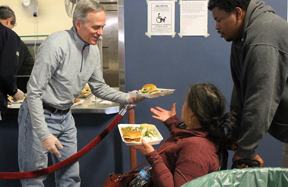 Notre Dame President Fr. John Jenkins serves meals in PDR