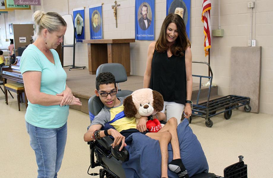 David drives his new wheelchair in SVdP's Family Dining Room.