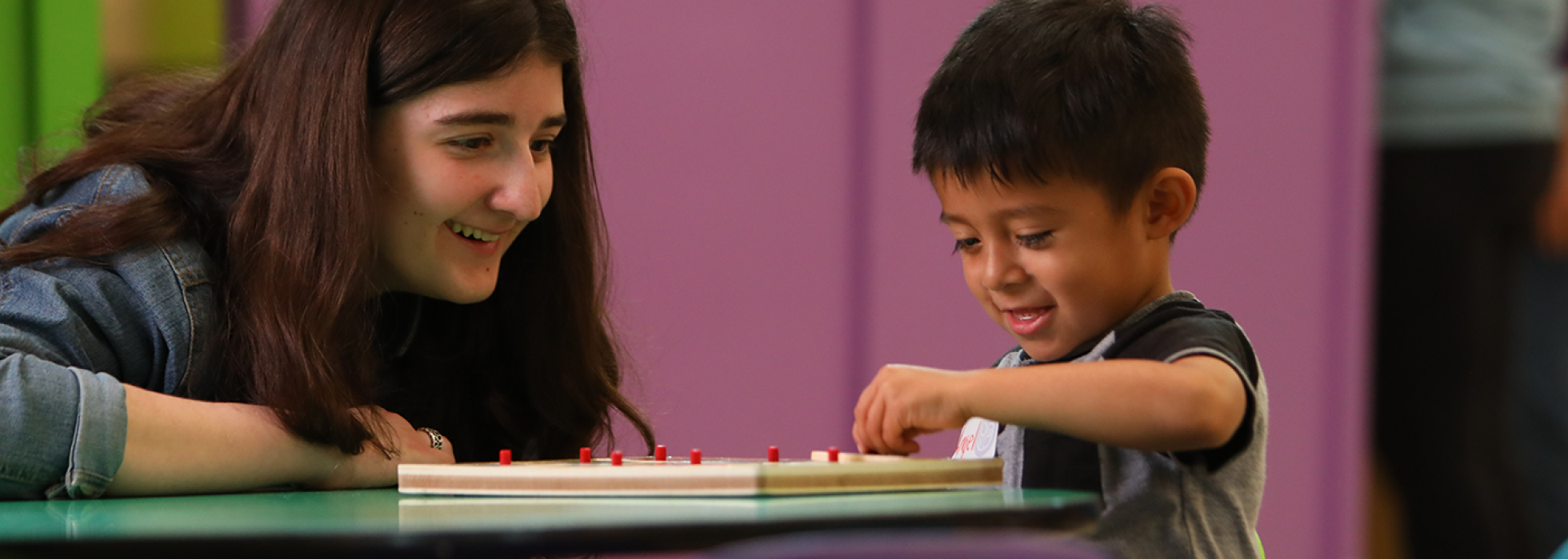 dream-center-campaign-header girl watching boy play a game