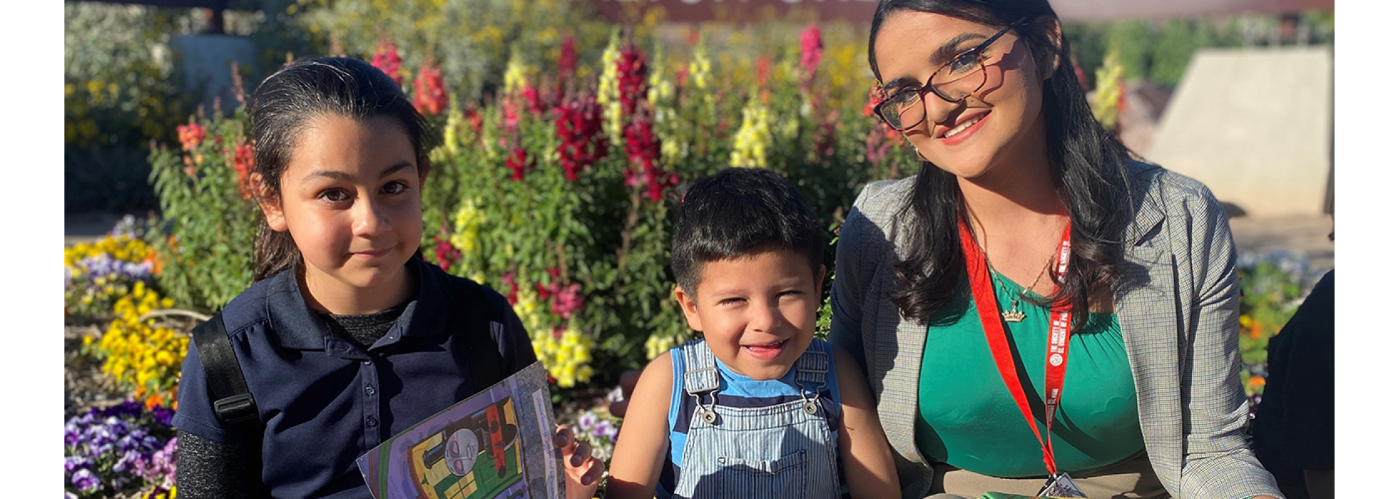 Scholarship campaign header girl sitting in the urban farm with two young kids