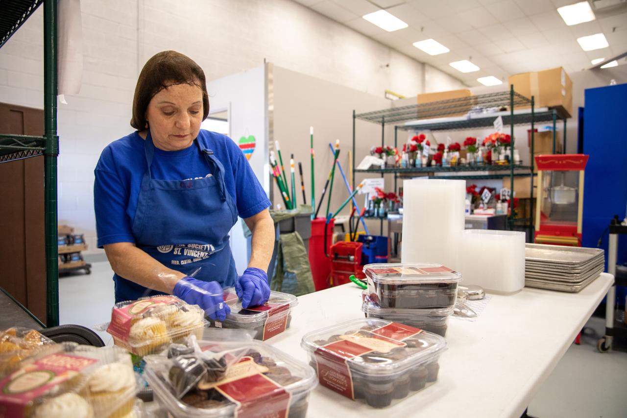 Woman unpacking items in a kitchen