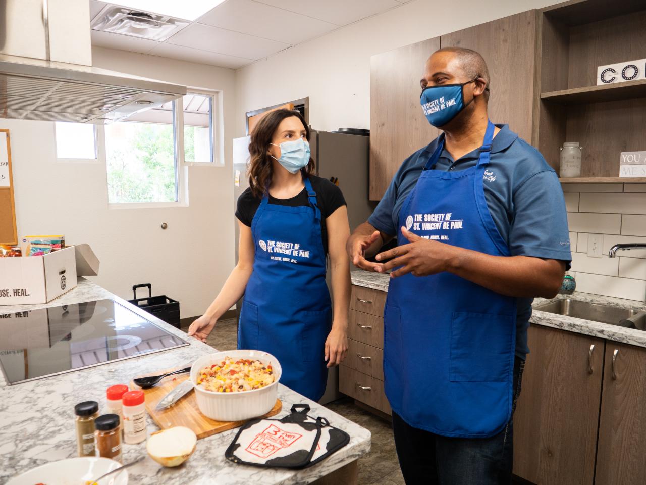 Two people standing in the SVdP Center for Family Wellness kitchen