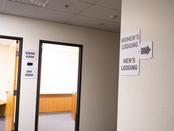 Hallway with two doors and signs