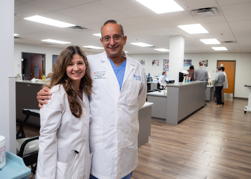 Two doctors standing together posing for the camera