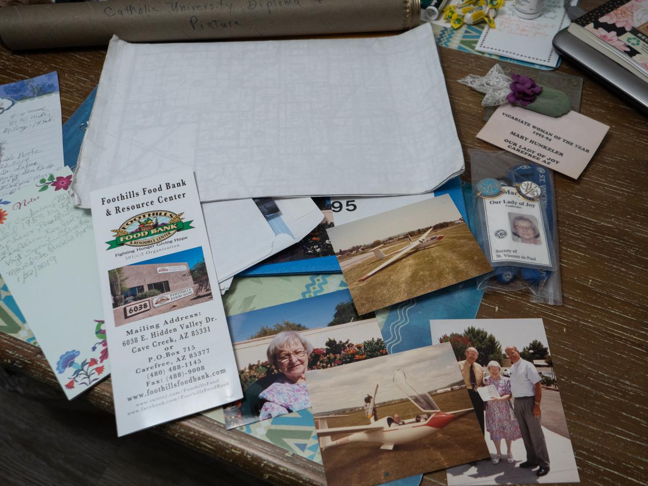 Papers and photos spread on a table