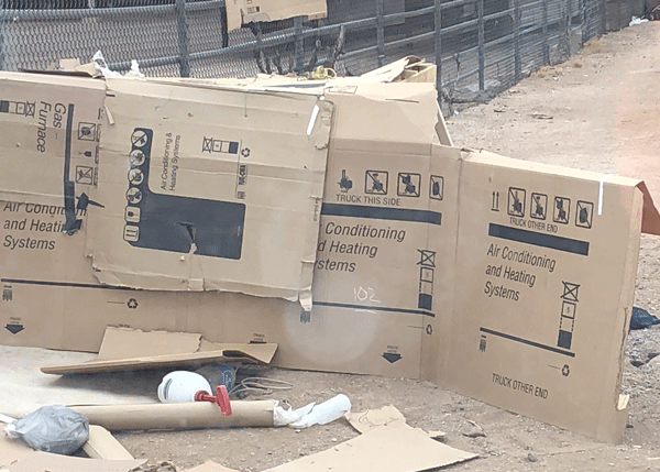 Cardboard boxes set up to shelter a homeless person