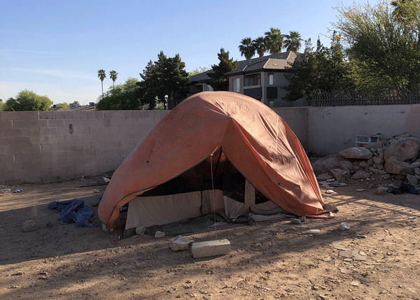 Tent in an abandoned lot