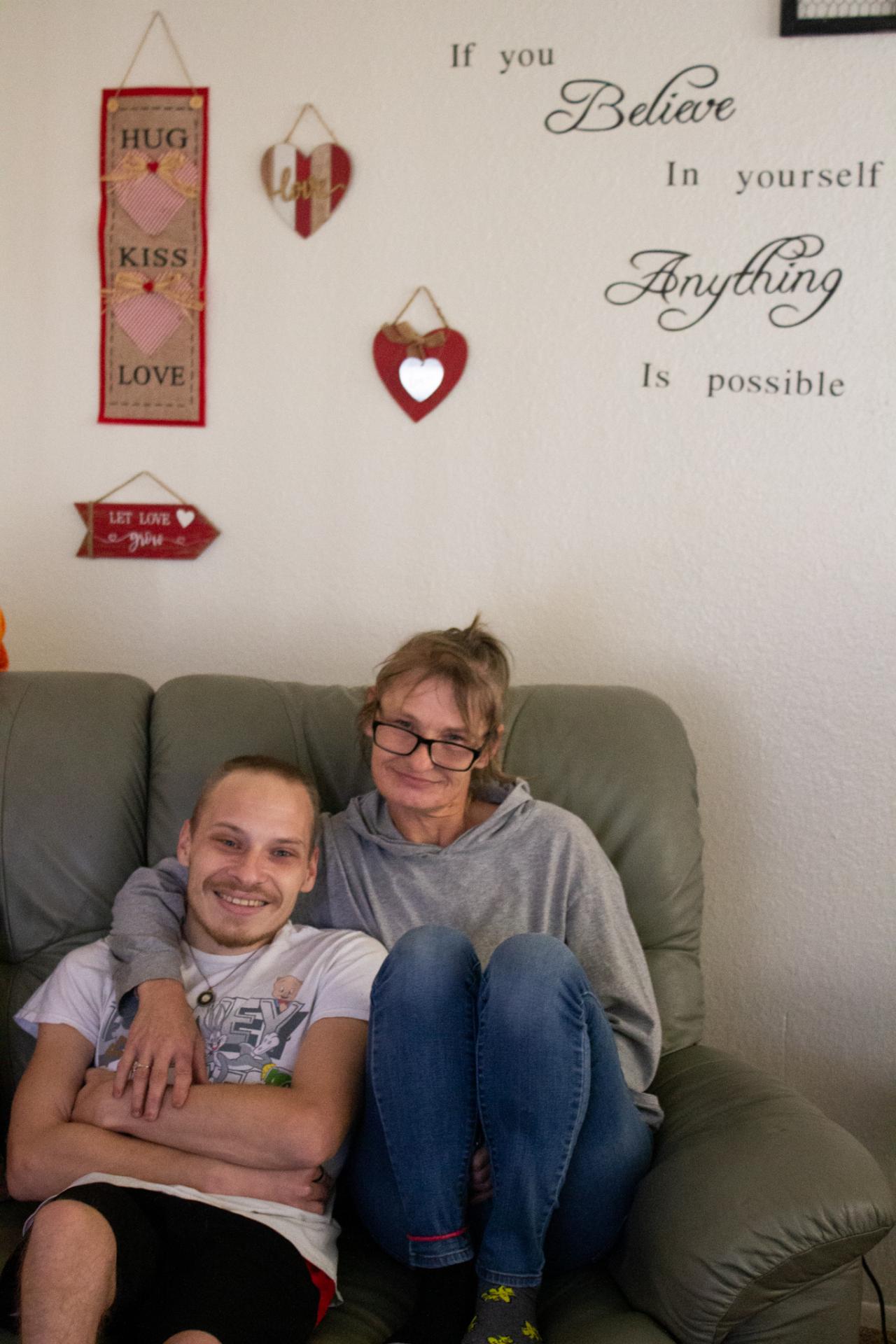 Tammy and Corey sitting on their couch