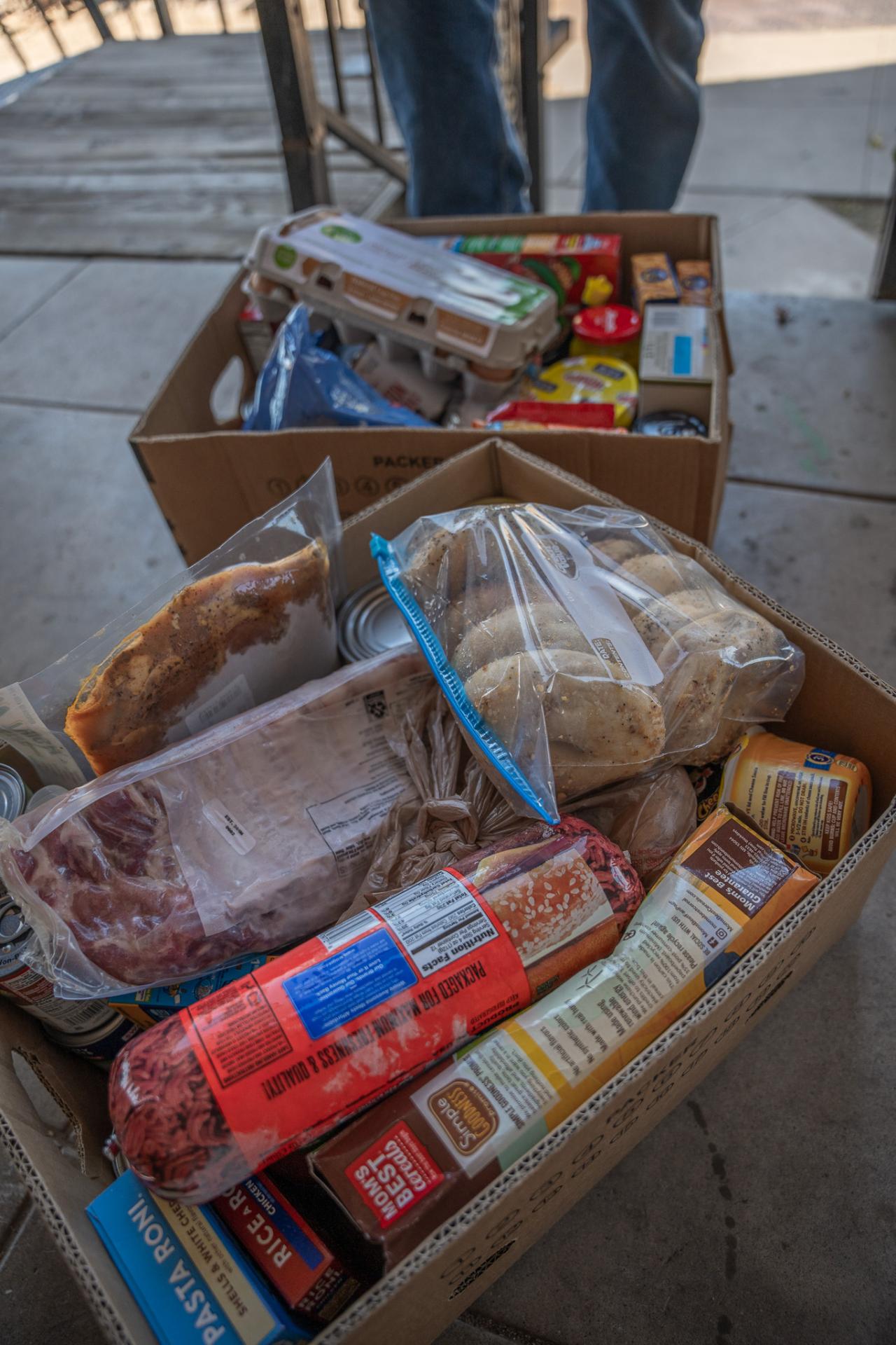 Two food boxes full of food.