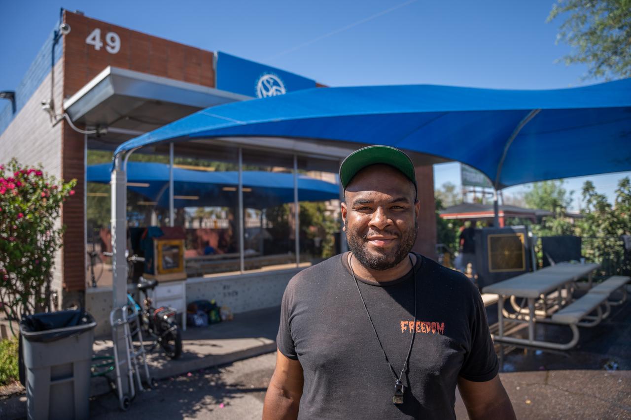 Diriki outside SVdP's Mesa Dining Room, where Diriki frequented when he was on the street and where he found the help to get his own place.