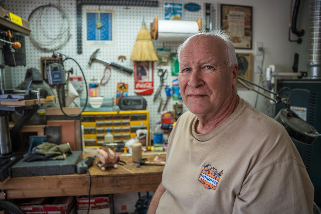 Tony Tofil poses in his home workshop.