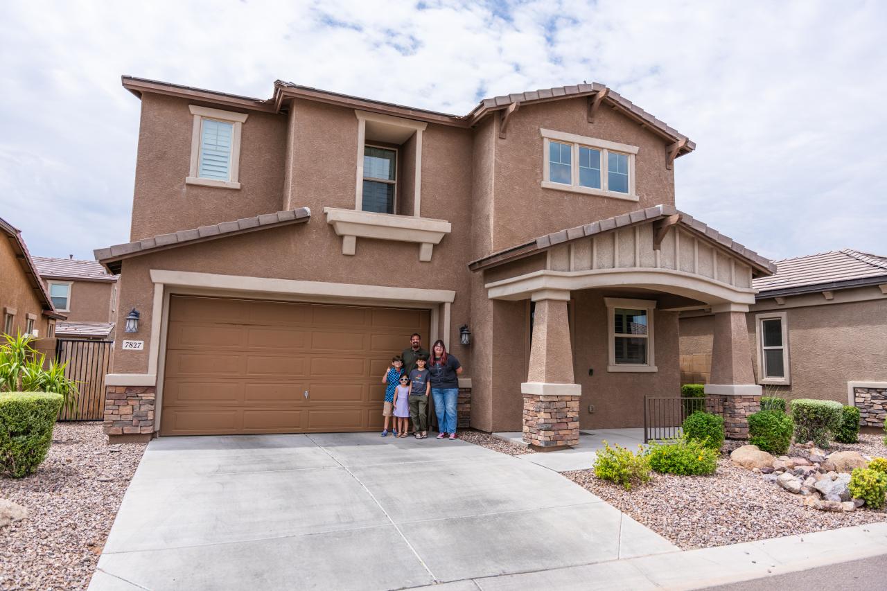 Lorente family outside their home 