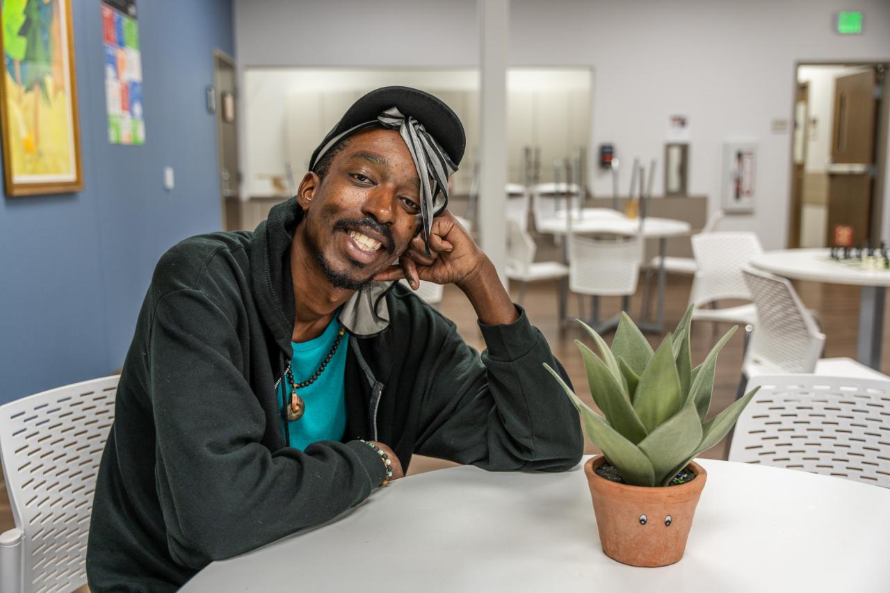 Jordon sits in Rosalie's Place's common room.