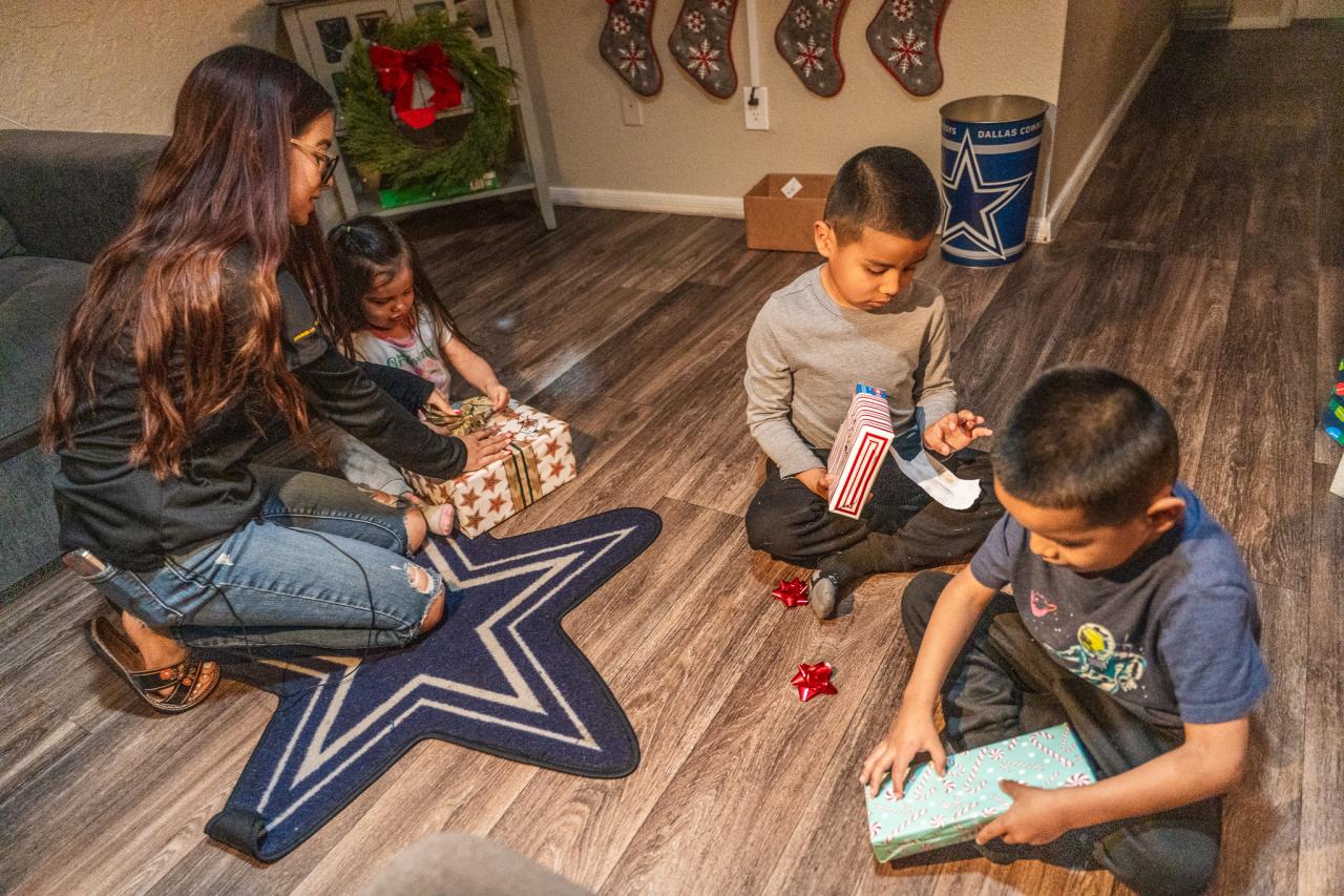 The kids open up their first presents for the holiday.