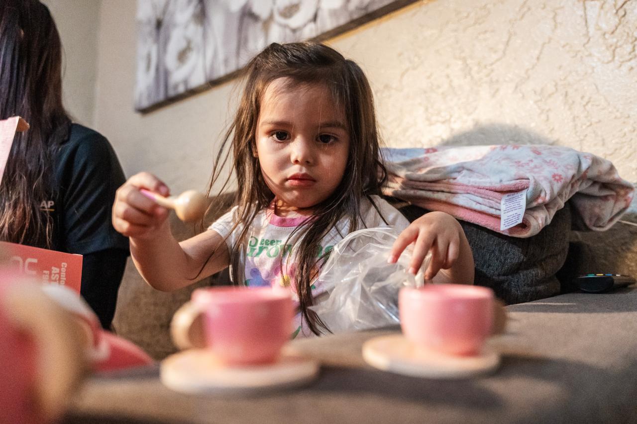 One of the kids enjoys their new present from the AAF program.